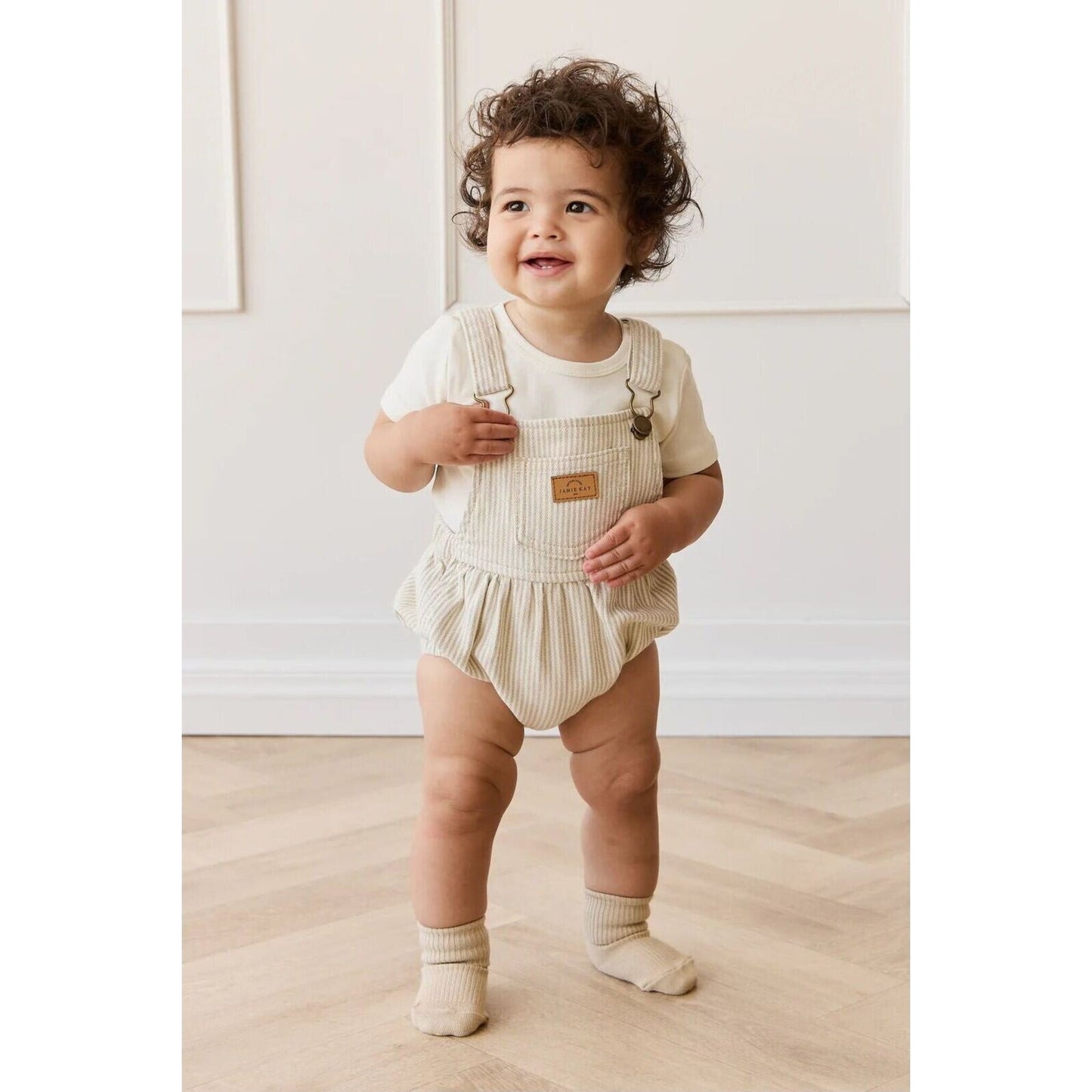 Pax Playsuit Fine Vertical Stripe Sandy Brown/Cloud – children's product by Jamie Kay | Aster & Ruby