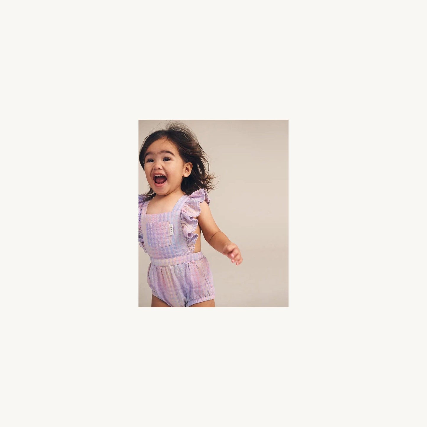 Rainbow Check Frill Playsuit – children's product by Huxbaby | Aster & Ruby