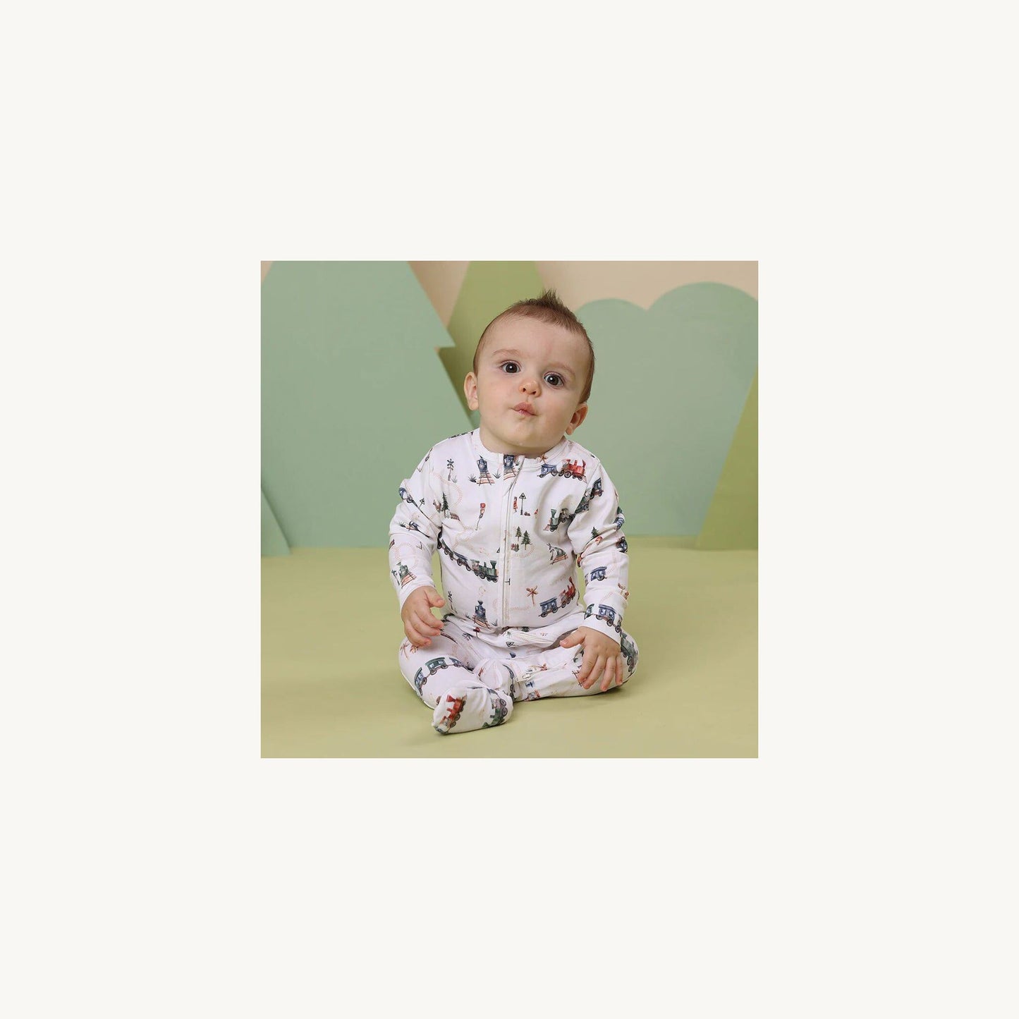 Trains Organic Snuggle Sleepsuit Zip Footie – children's product by Snuggle Hunny Kids | Aster & Ruby